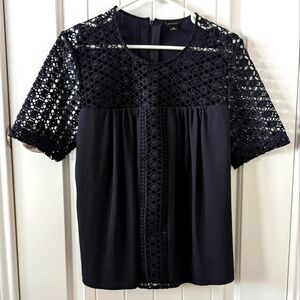 Embroidered navy blue blouse by Ann Taylor. Size Medium